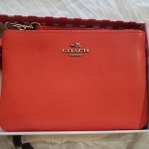 Coach wristlet coral